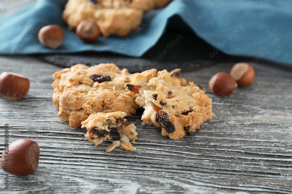 Delicious oatmeal cookies on wooden background, closeup