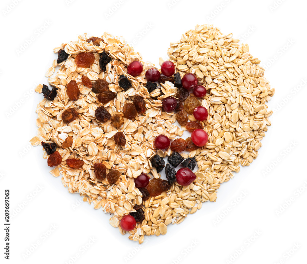 Composition with raw oatmeal, raisins and cranberries on white background