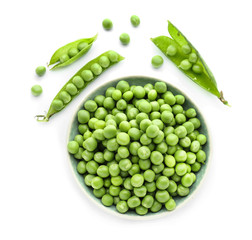 Bowl with green peas on white background