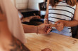 © Jacob Lund - Woman entrepreneur accepting payment by card at the billing coun