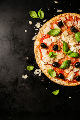 Wall Mural - Traditional italian pizza on dark table
