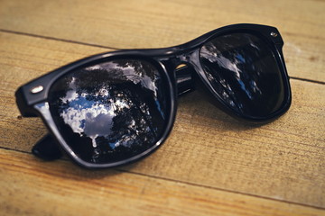 black glasses on a wooden table