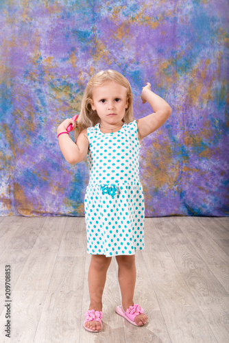 A Child A Little Girl Combs Her Hair Daily Hair Care And Hygiene