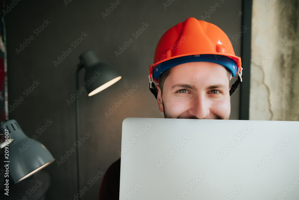Young designer working in his studio on new project. Programmer working ...