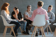 © Photographee.eu - Therapist talking to young rebellious people with problems