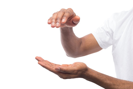 Black man holding palm down isolated on white
