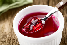 Eating Red Jelly Or Jello, Spoonful Of Jelly On The Top (Selective Focus, Focus In The Middle Of The Image)