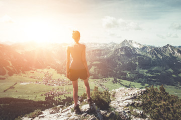 Wall Mural - healthy fit young woman hiker on a mountain summit
