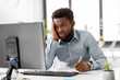 © Syda Productions - business, people, paperwork and technology concept - stressed african american businessman with computer and papers working at office