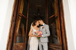 © Wedding photography - Wedding couple in love at wedding day. Beautiful bride and groom with wedding bouquet embracing after wedding ceremony