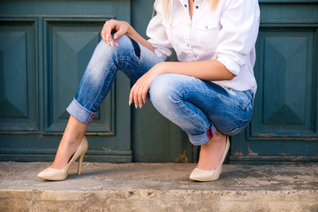 Woman wearing jeans and high heels 