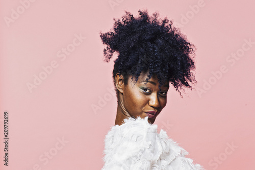 Portrait Of A Young Girl With Curly Hair Ponytail Looking At