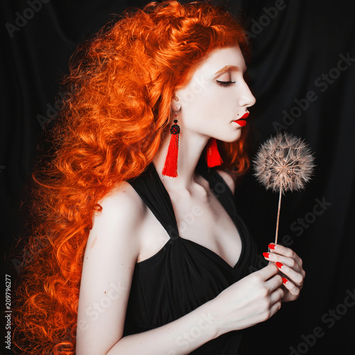 Young Beautiful Unusual Redhead Girl With Curly Hair On A
