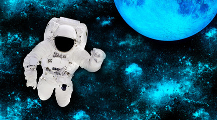 Poster - Astronaut in a spacesuit in outer space. Spaceman on the background of the planet. Space landscape. Elements of this image furnished by NASA 