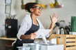 © Joshua Resnick - friendly waitress welcoming customers at cash register