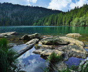  Glacial Black Lake   (Cerne jezero) with crystal-clear water surrounded by the forest is the most beautiful and the largest morainic lake in Sumava mountains (Bohemian Forest).