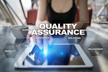 Quality assurance concept on the virtual screen. Business concept.