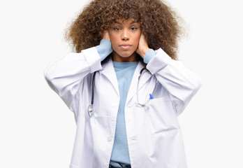 Poster - African american doctor woman, medical professional working covering ears ignoring annoying loud noise, plugs ears to avoid hearing sound. Noisy music is a problem.