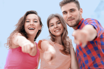 Canvas Print - closeup of three young people showing hands forward