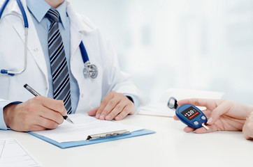 Doctor and patient diabetes consultation in office or clinic.