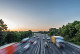 Sunset view heavy traffic moving at speed on UK motorway in England