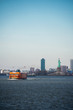 New York City Skyline over the waterfront with Stanton Island Ferry and Statue of Liberty