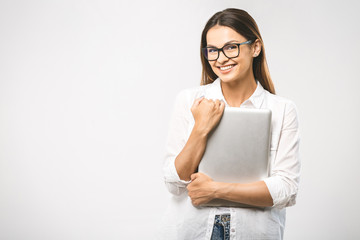 Wall Mural - Wow! It's amazing. Portrait with copy space empty place of pretty charming confident trendy woman in classic shirt having tablet in hands looking at camera isolated on white background.
