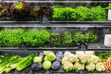 Fresh organic green vegetables on display in a French supermarket. Paris, France