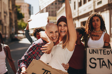 Wall Mural - Female activists enjoying at protest