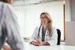 © bnenin - Smiling female doctor with a patient in the office.
