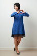 © soleg - woman posing in blue dress, shows the shape of the heart