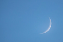 New Moon In The Daytime On The Day Blue Sky