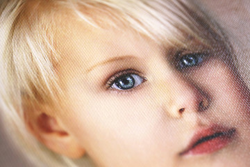 close up on details of portrait of little girl printed on cotton canvas gallery wrap