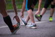 © .shock - runners team warming up and stretching before morning training