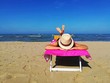 Woman sunbathing at the sea