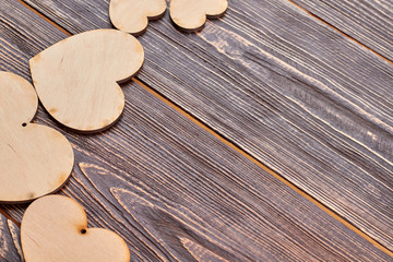 Decorative wooden hearts and copy space. Blank wooden heart shaped cutouts for decoupage. Wedding decoration idea.