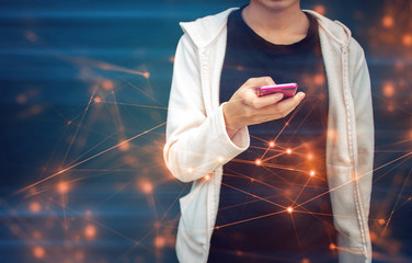 Wall Mural - teen girl with social online smartphone network and blue wall background