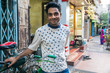 © Wynn Myers - Young man standing on street in India