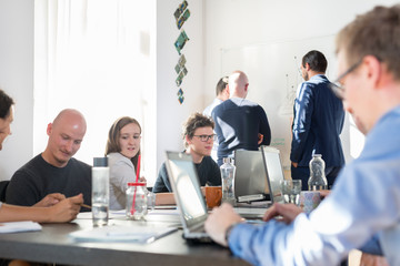 Wall Mural - relaxed informal it business startup company meeting. team leaders discussing and brainstorming new 