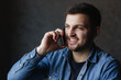 © Aleksandr - Young businessman taking a call in cafe