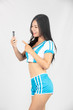 © artit - Cheerleader holds a smartphone, Cute, Beautiful stylish girls cheerleaders.