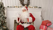 © fancystudio - Laughing Santa Claus reading Christmas messages from kids