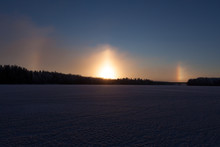 Sundogs At Winter On Frozen Lake