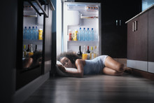 Black Woman Awake For Heat Wave Sleeping In Fridge
