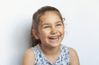© kaganskaya115 - Portrait of a happy laughing child girl. Smiling child. Expressive facial expressions.