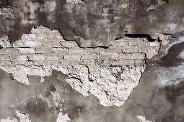 Old gray brick and plaster wall texture background