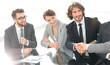 © ASDF - handshake partners at a business meeting