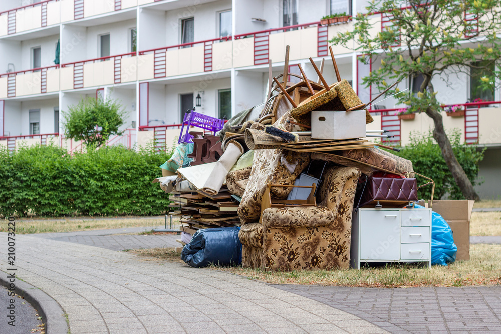 Big pile of old furniture and household goods on the roadside - obrazy, fototapety, plakaty 