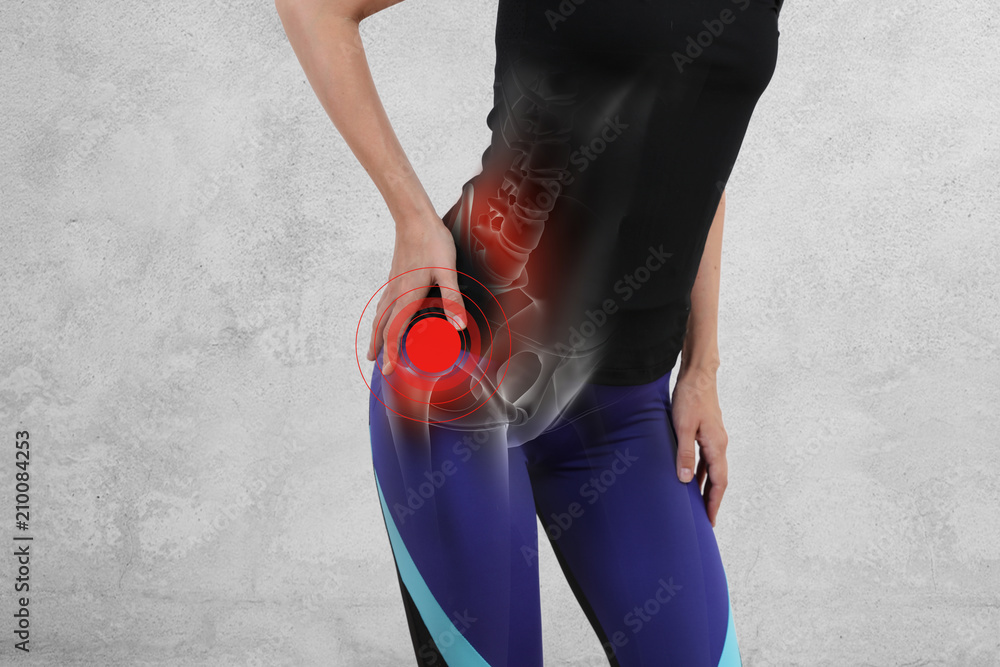 Woman with hip joint pain. Sport exercising injury - obrazy, fototapety, plakaty 