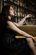 © Demian - Beautiful fashionable woman at a bar